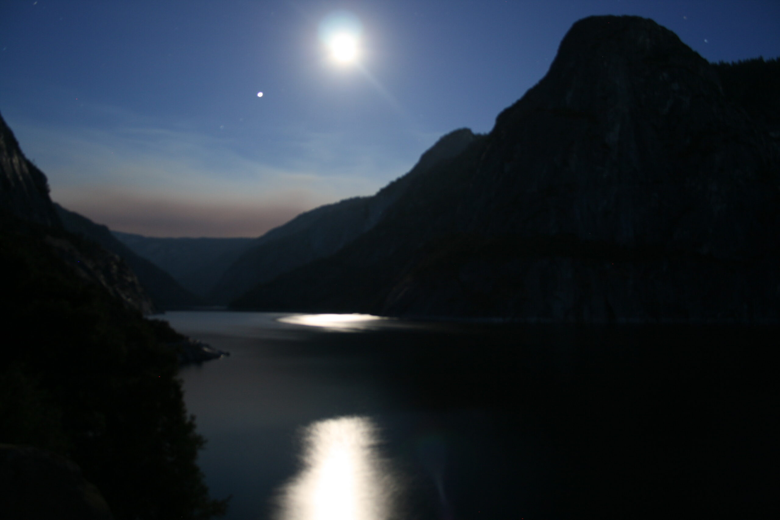 Hetch Hetchy reservoir view at sunset with moon reflection