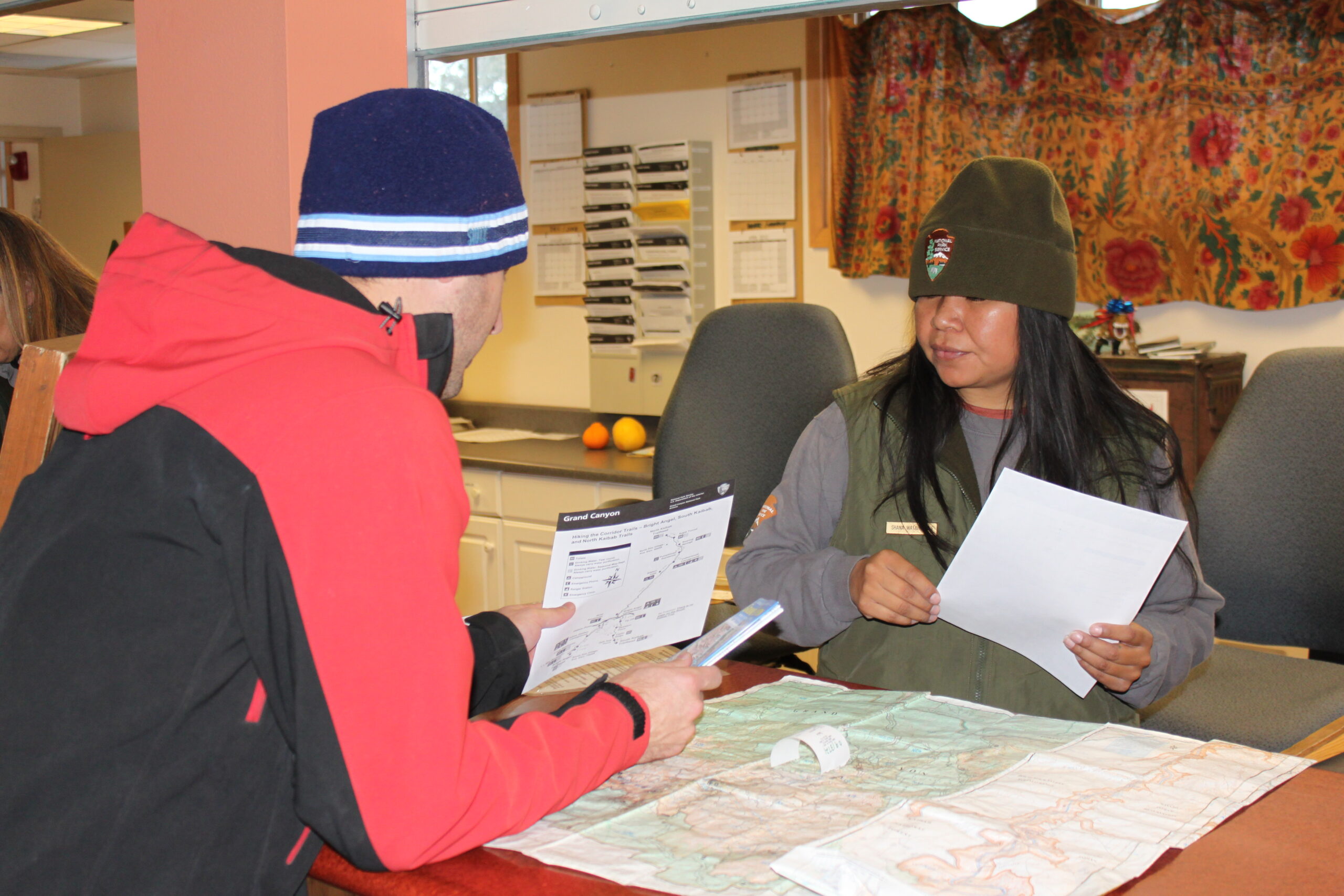 Hank discusses an itinerary with a Grand Canyon Park Ranger at the Backcountry Information Center.