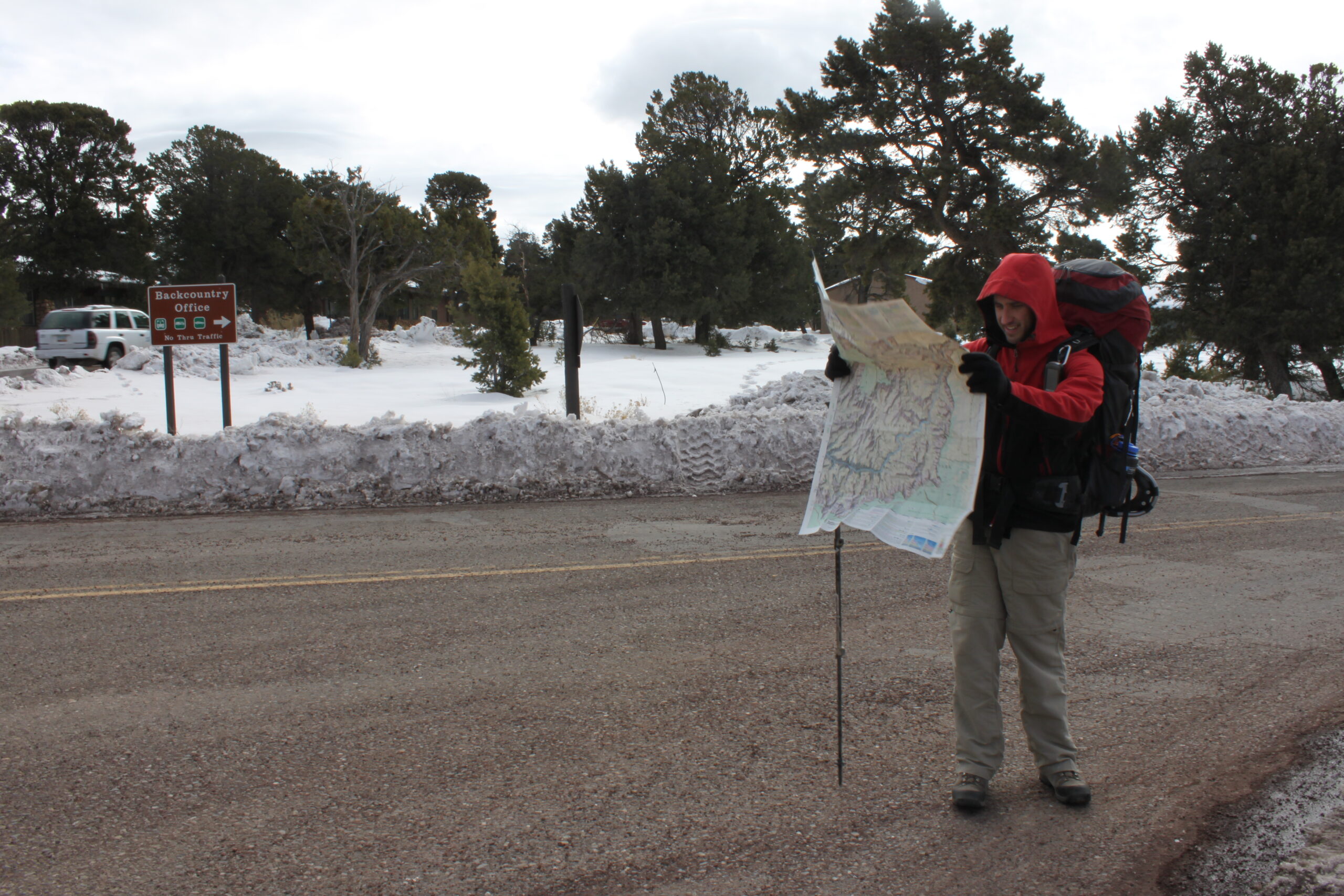 Hank searches for the Grand Canyon's Bright Angel Trailhead on a topographical map.