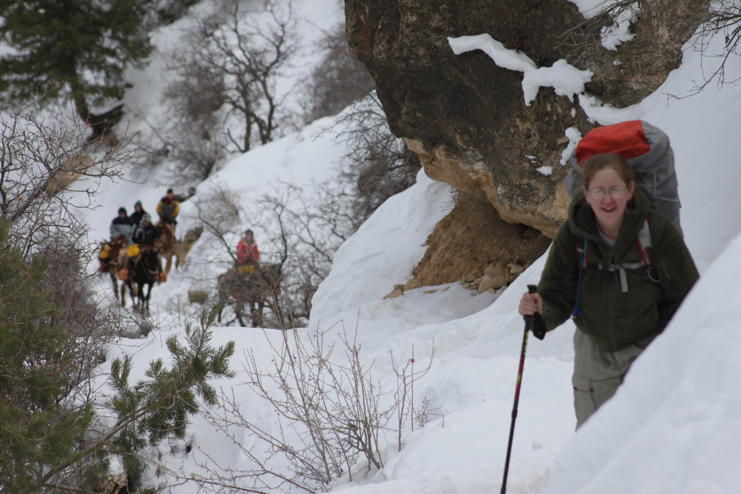 A woman laughs as she spies Santa Claus approaching her on Bright Angel Trail.