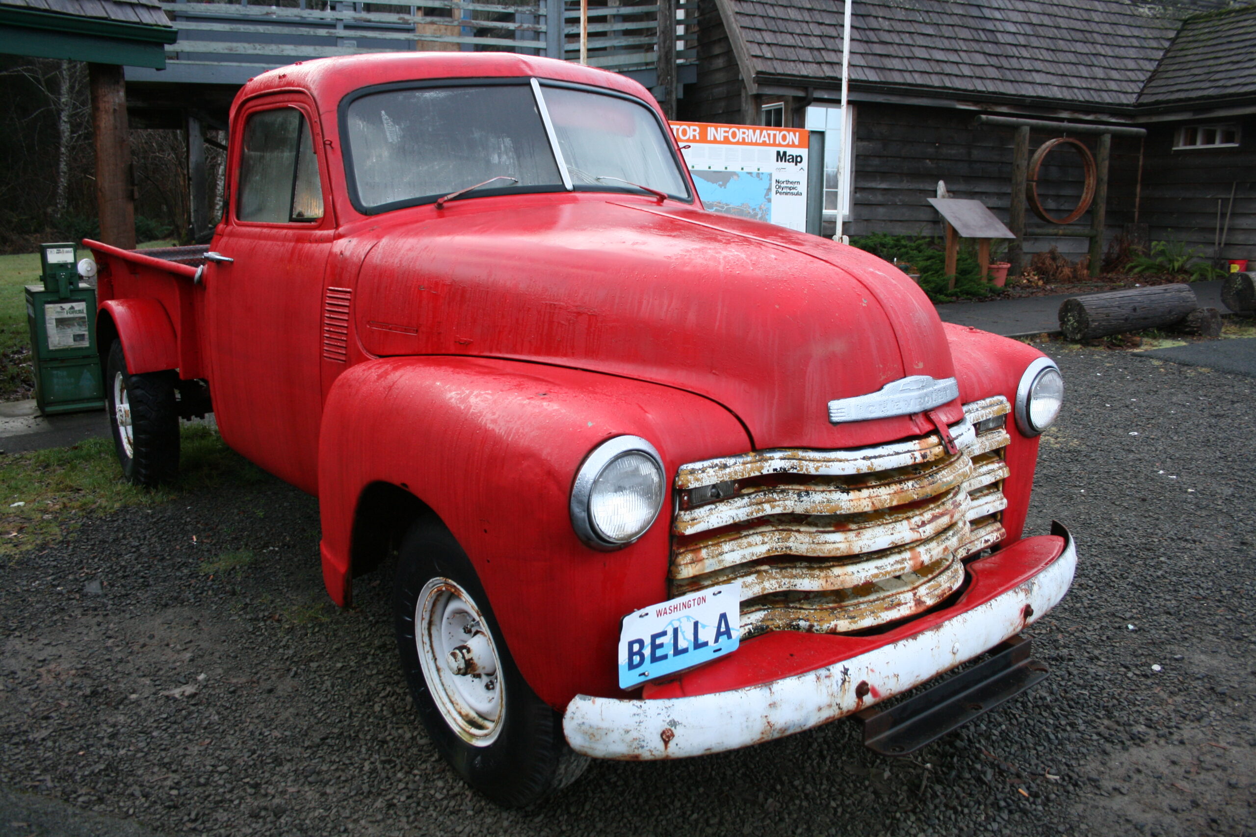 Bella's red, 1953 Chevrolet pickup truck sits outside the Forks Chamber of Commerce.