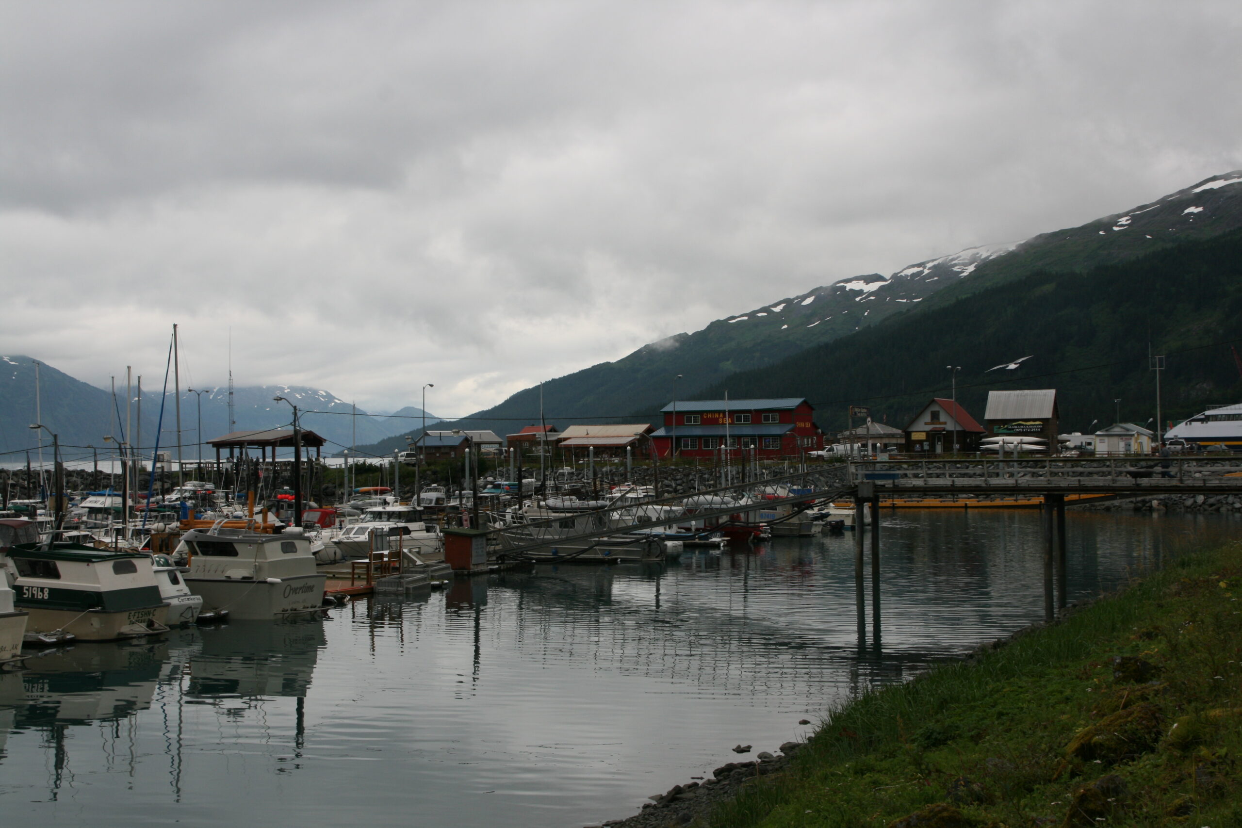 Boats sit in a harbor in Whittier, Alaska on the Prince William Sound.
