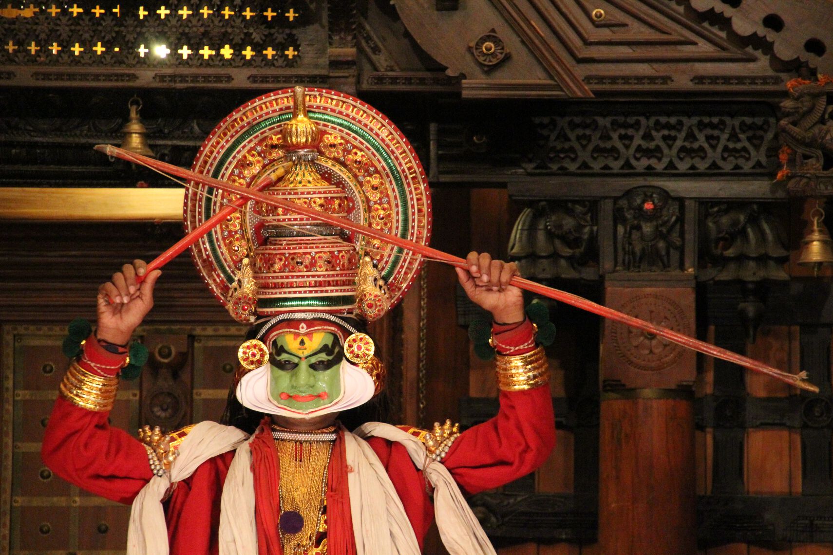 An actor wearing elaborate makeup performs Kathakali in Fort Cochin, India. 
