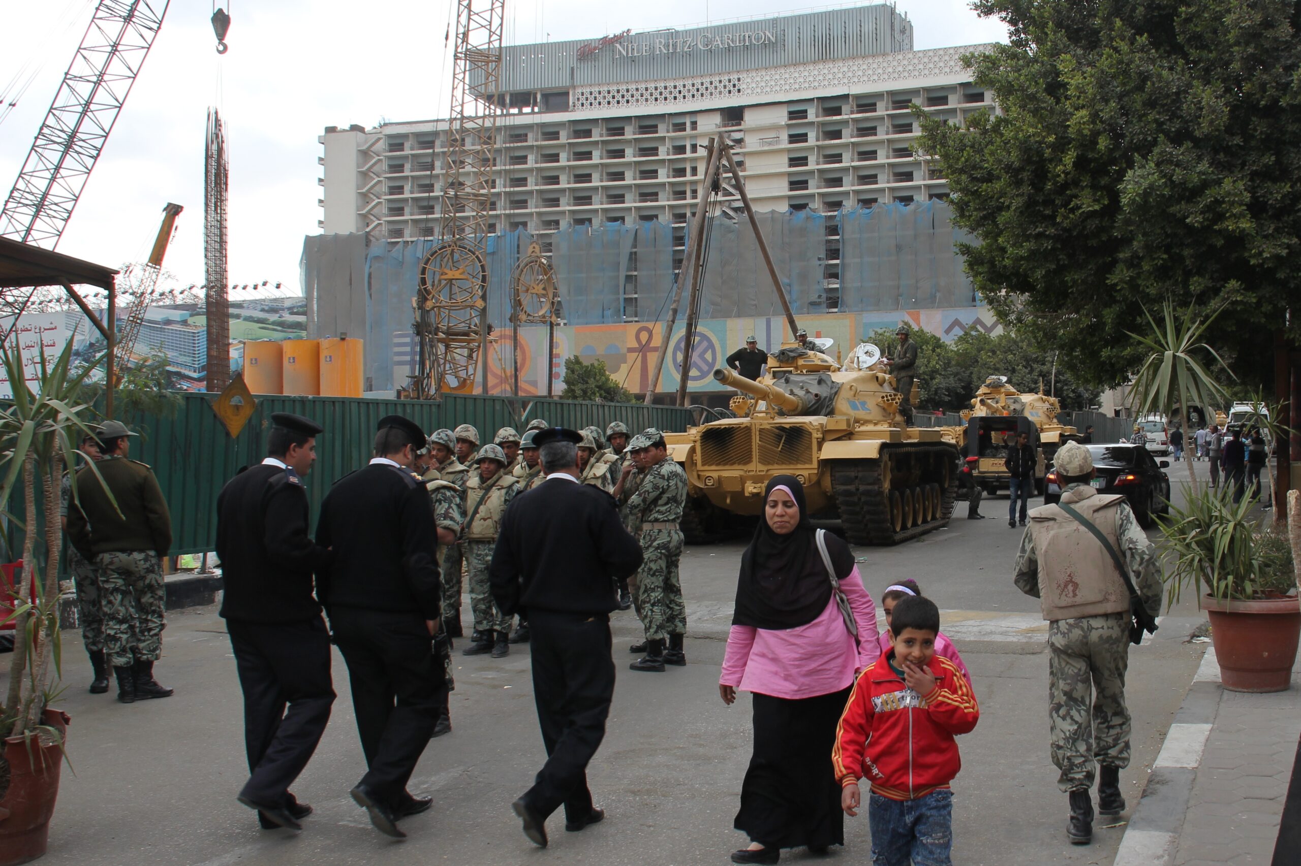 Soldiers and security officers walk near tanks outside Cairo's Egyptian Museum.
