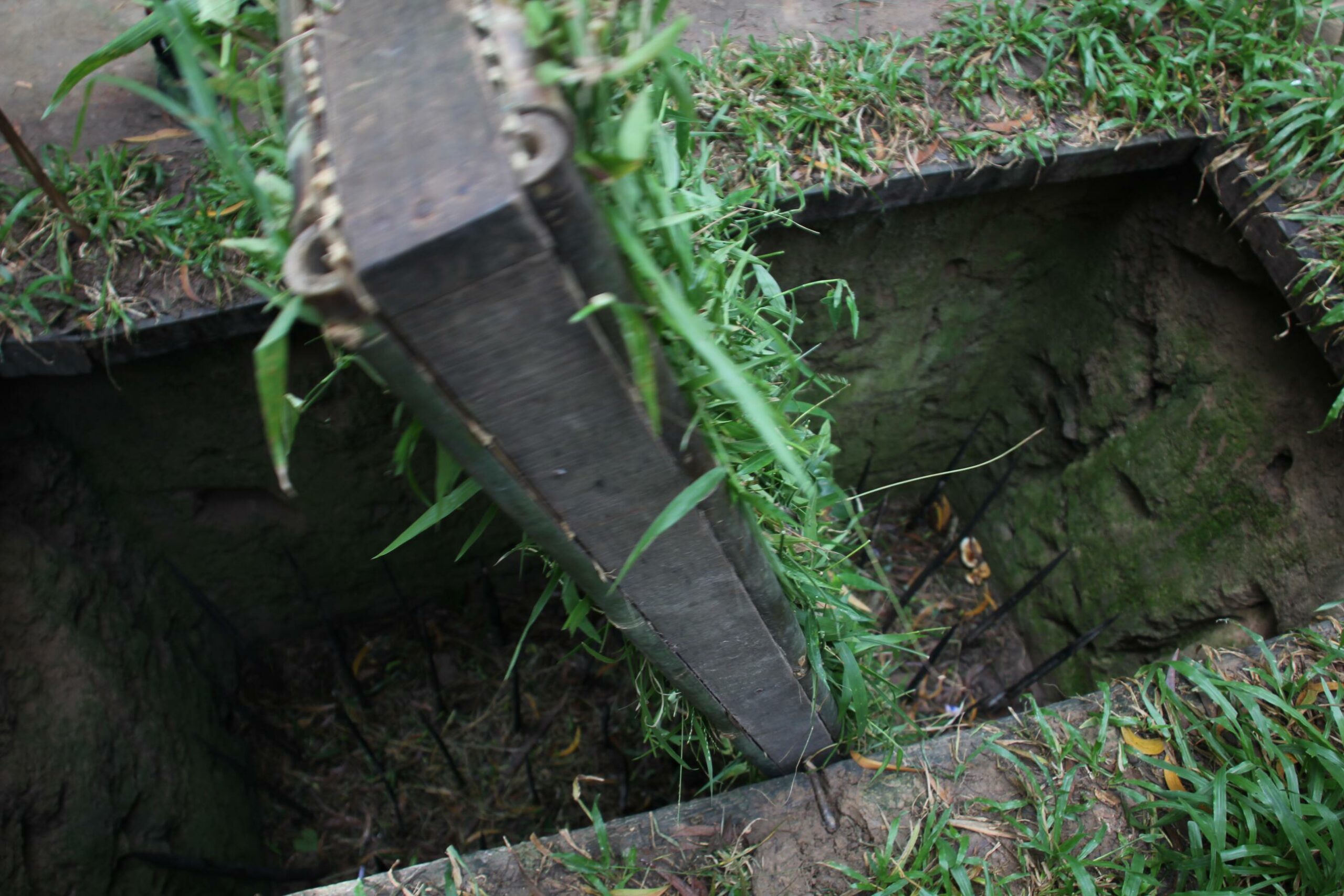 A spike trap lies underground at Vietnam's Cu Chi Tunnels.