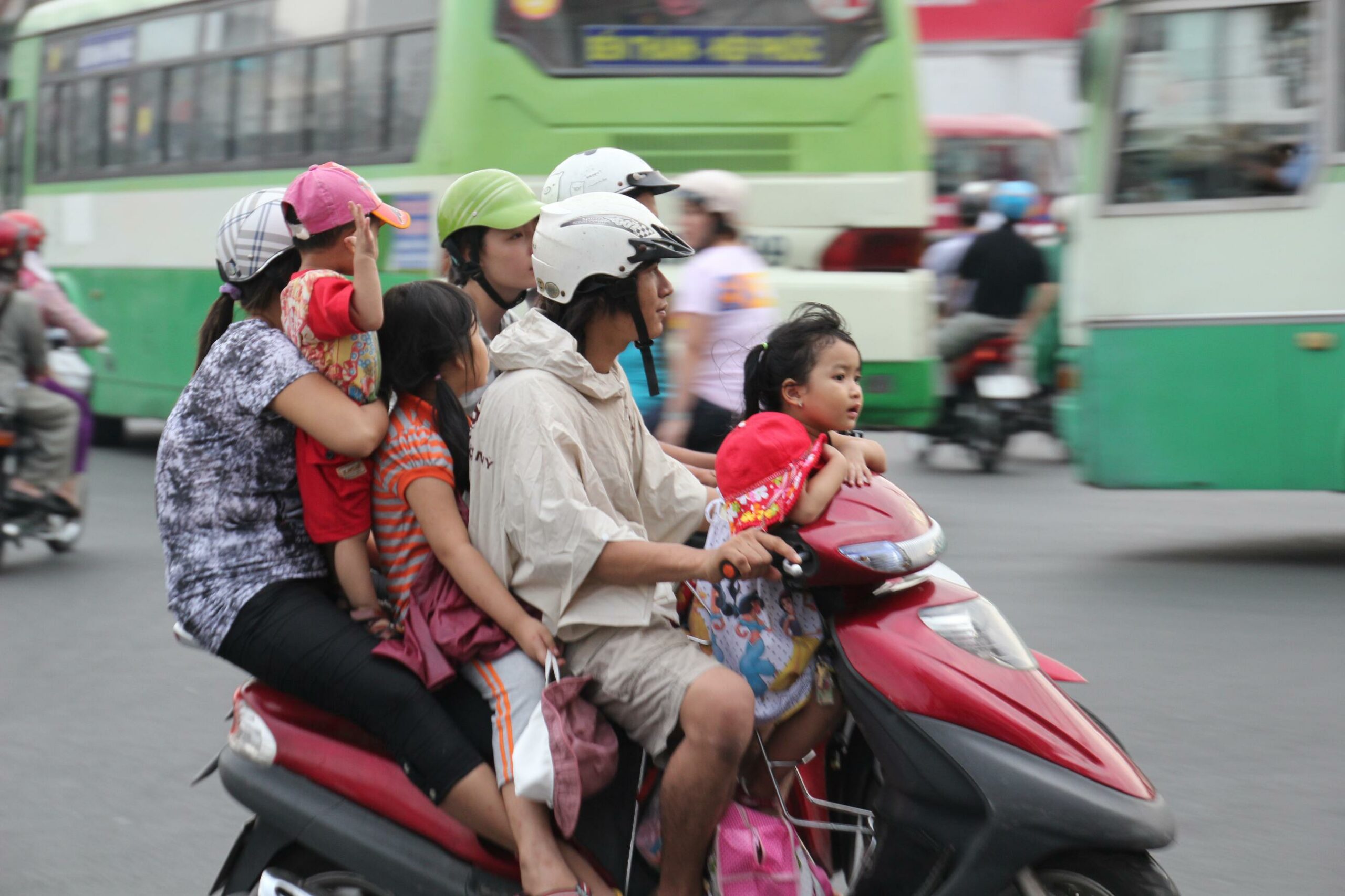 A five-person Vietnamese family squeezes on to a motorcycle in Ho Chi Minh City, Vietnam.