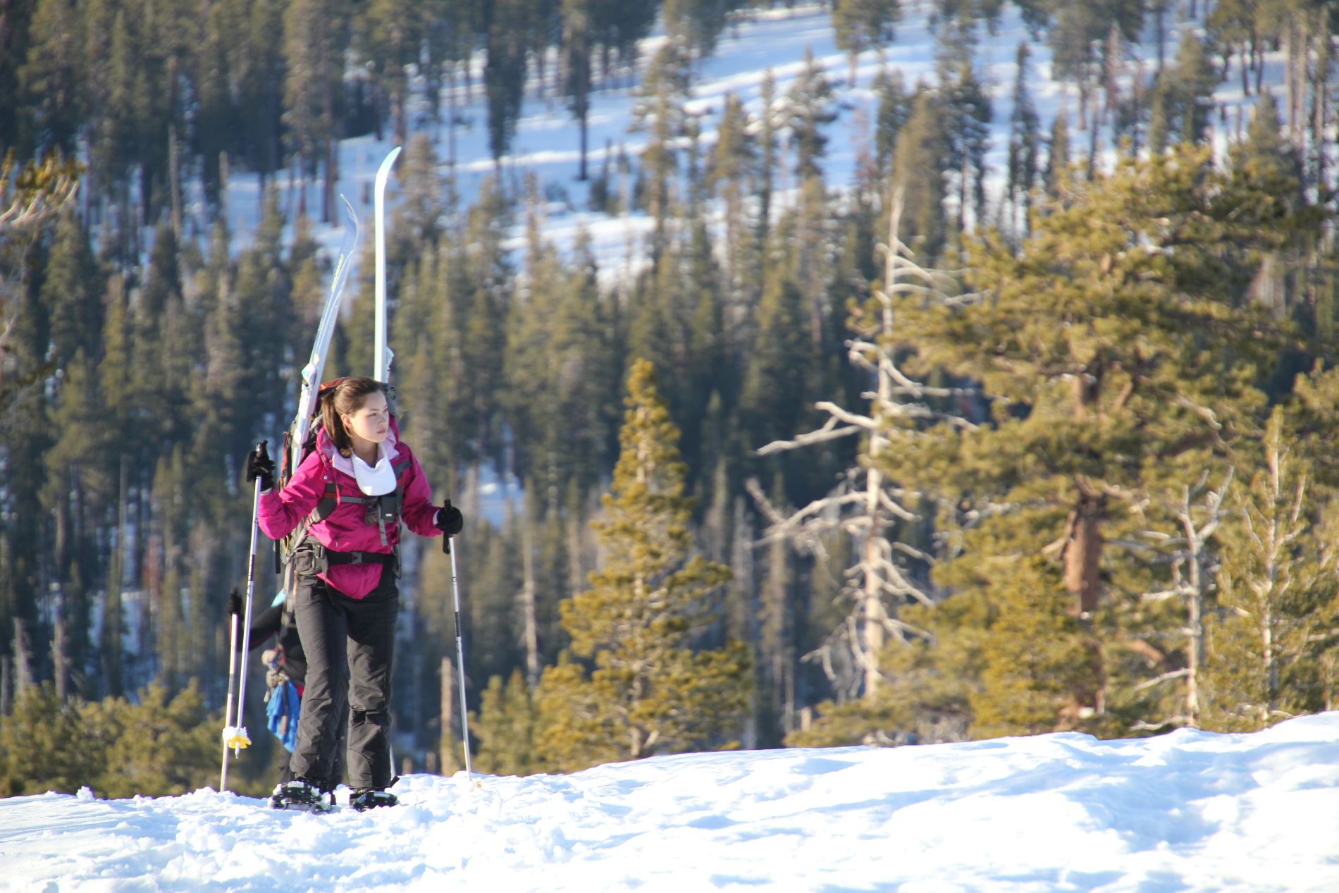 A hiker snowshoes up Horizon Ridge.