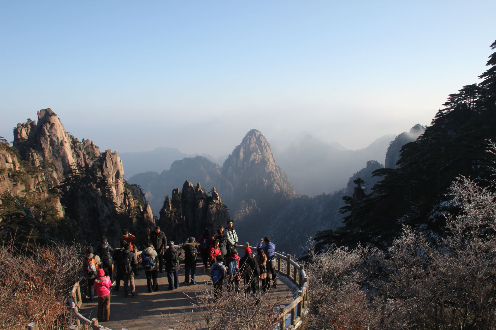 Chinese tourists admire a view near the summit of Huangshan.