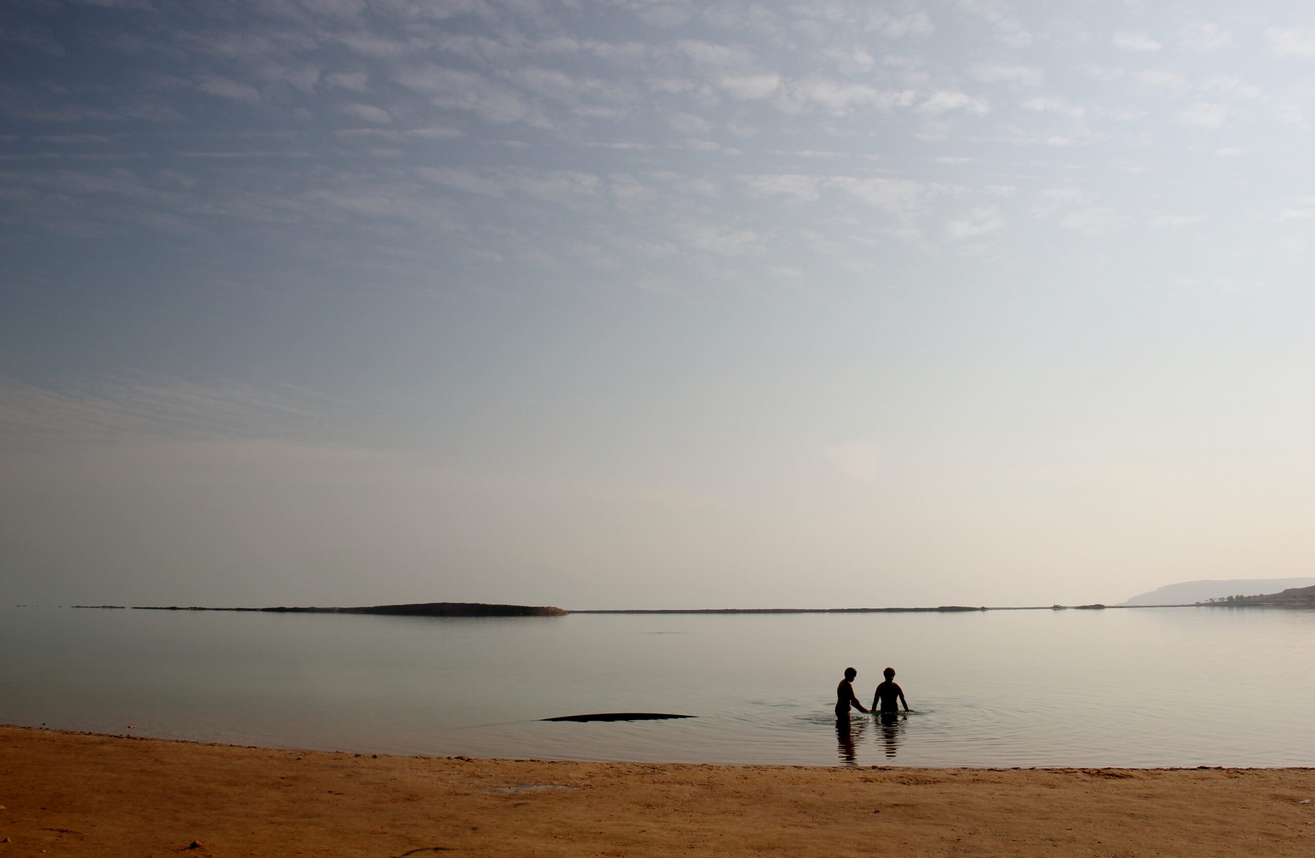 People swim at Ein Bokek's public beach on the Dead Sea in the West Bank near Jerusalem, Israel.