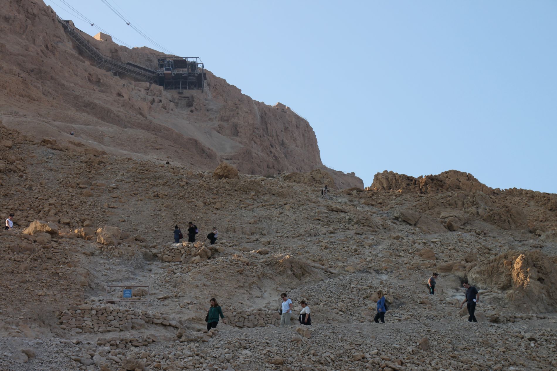 Tourists walk on the Snake Path leading to the top of Masada.
