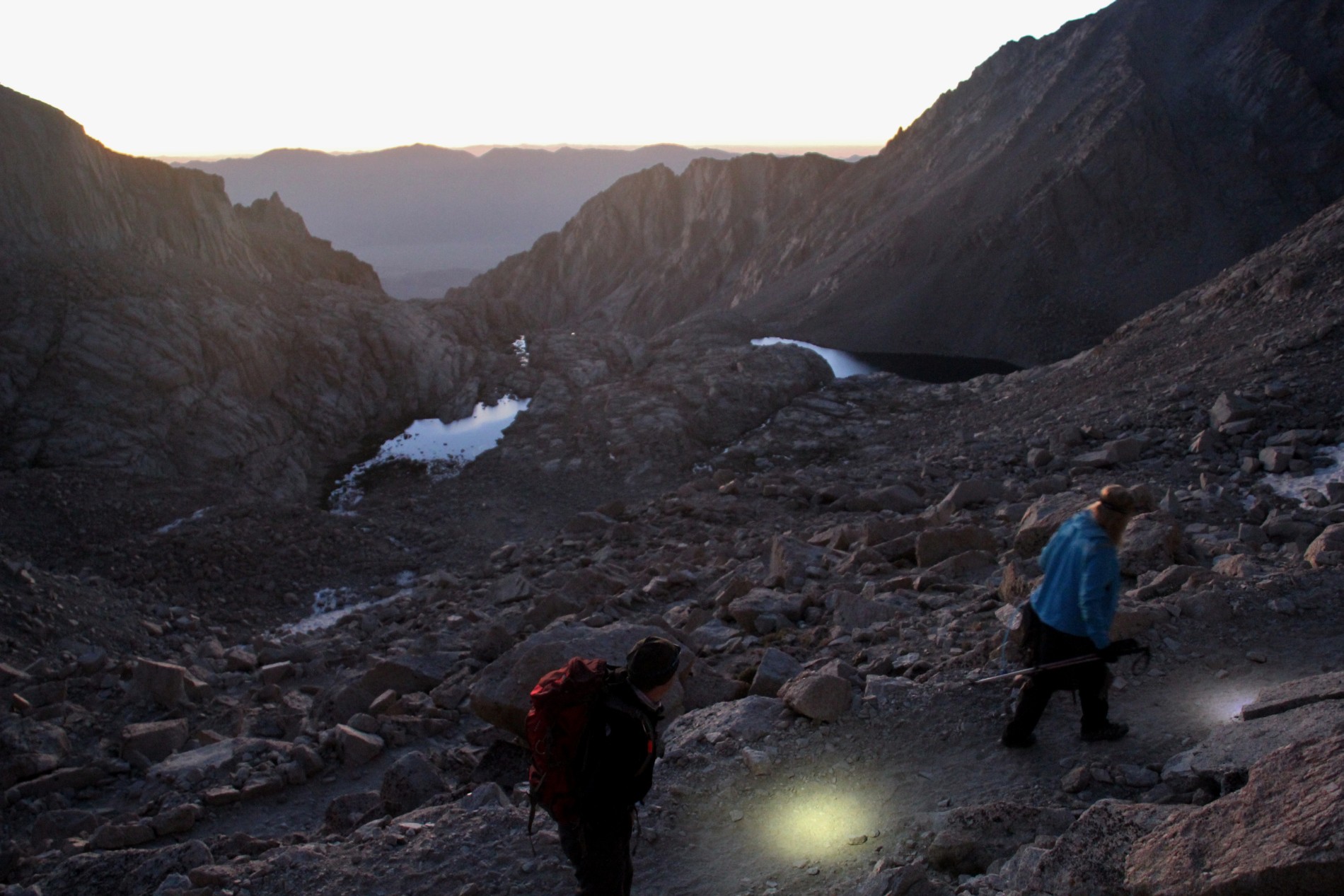 Backpackers hike up the Mount Whitney Trail's 99 switchbacks at sunrise.