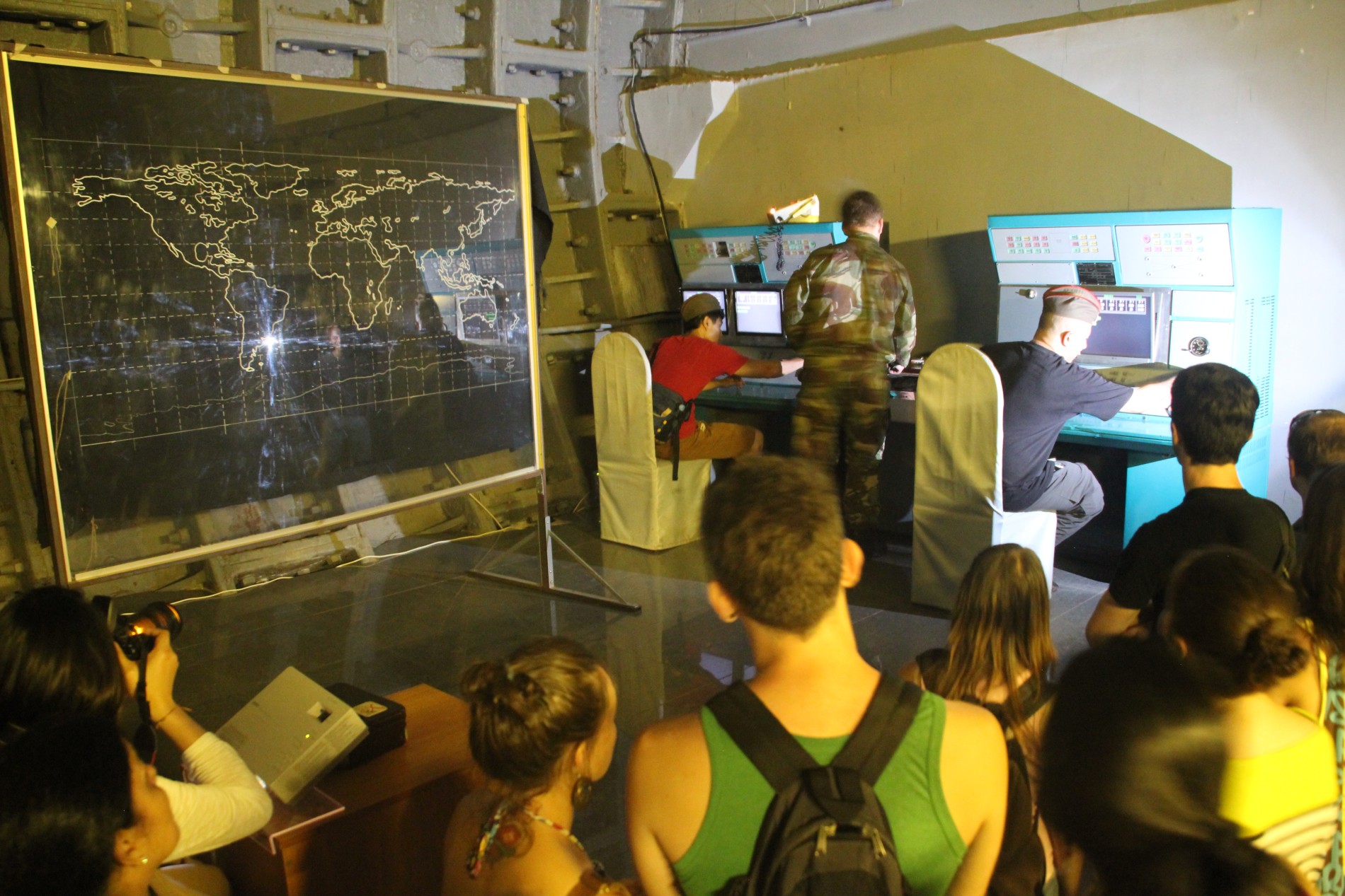 Tourists watch a nuclear war simulation in Moscow's Bunker 42.