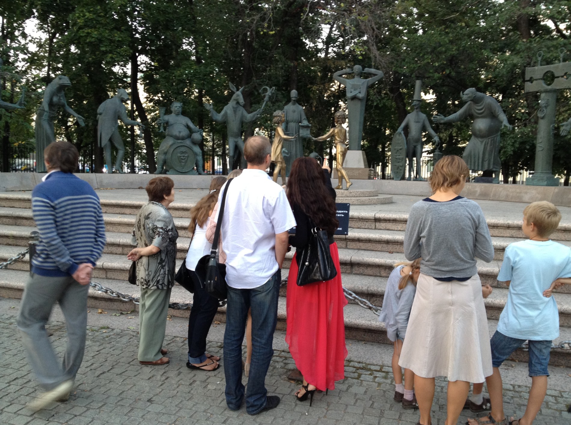 Tourists look at The Sins Monument in Bolotnaya Ploshchad in Moscow.