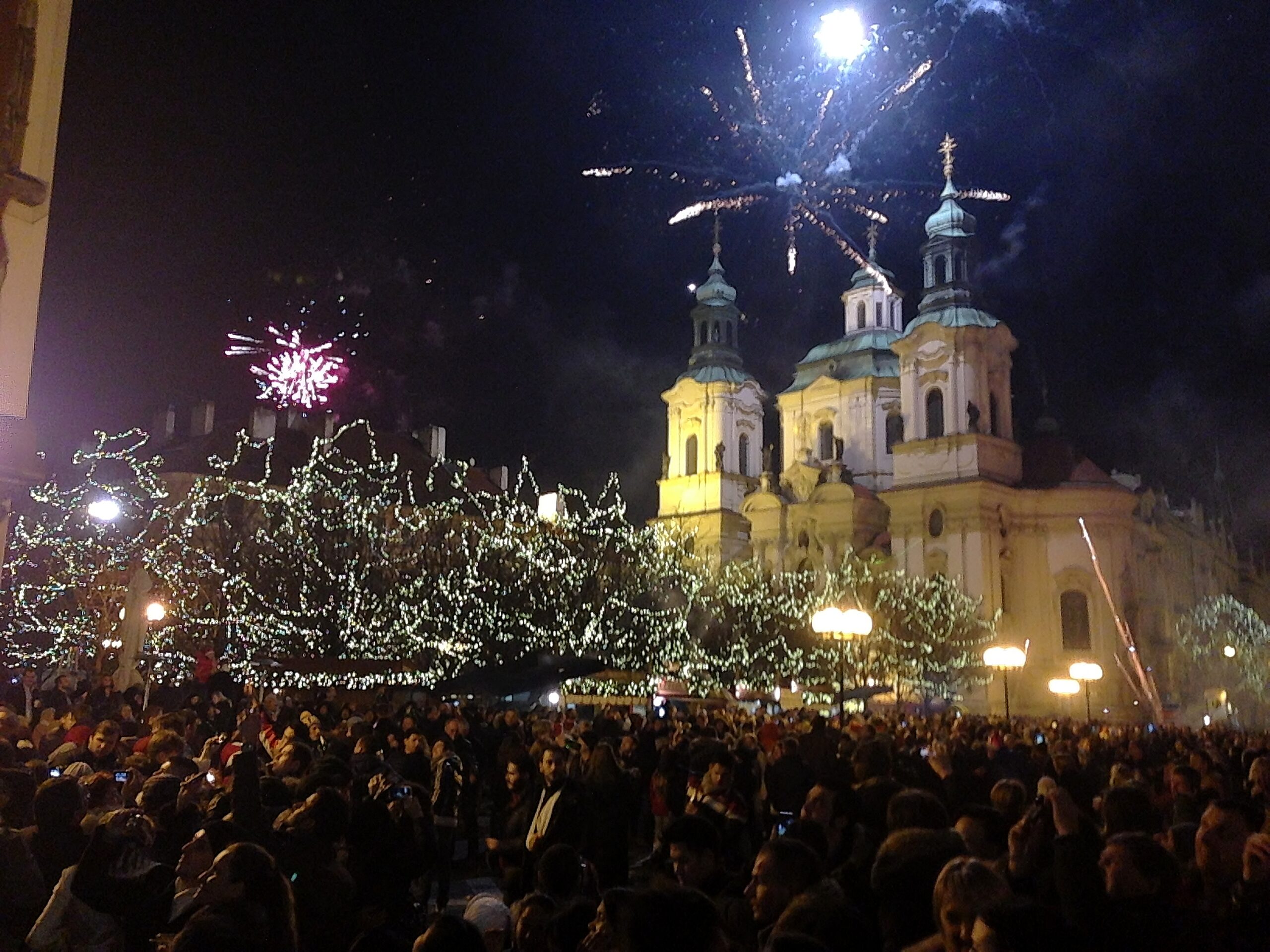 Amateur fireworks shows dazzle visitors to Prague's St. Nicholas Church in Old Town Square on New Year's Eve, 2012.