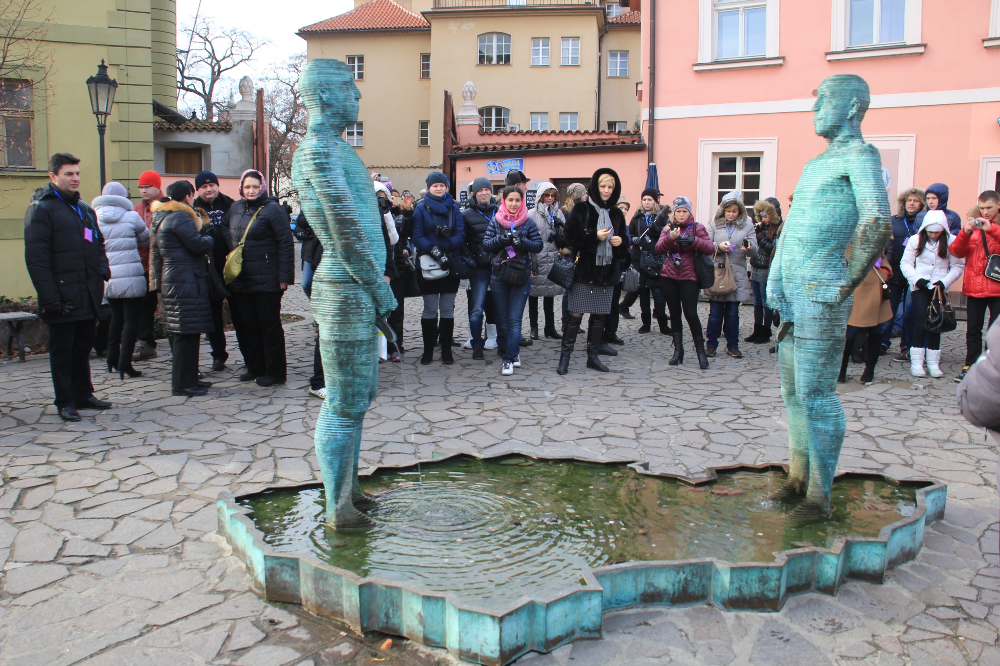 David Cerny's Pissing Men Statue greets visitors to Prague's Kafka Museum,