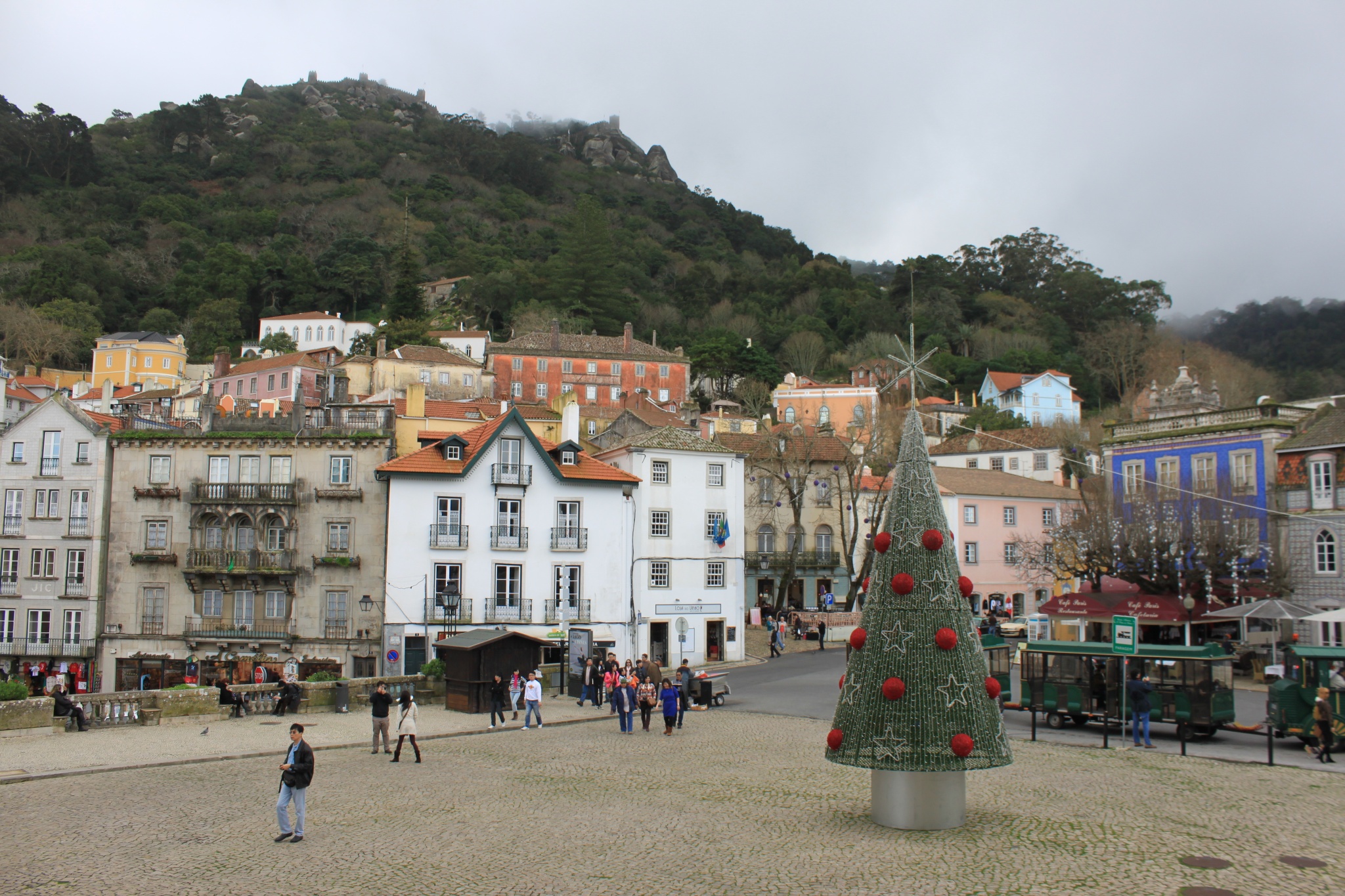 The Pena National Palace sits on a hill above the Sintra town square, featuring a steel, abstract Christmas tree.