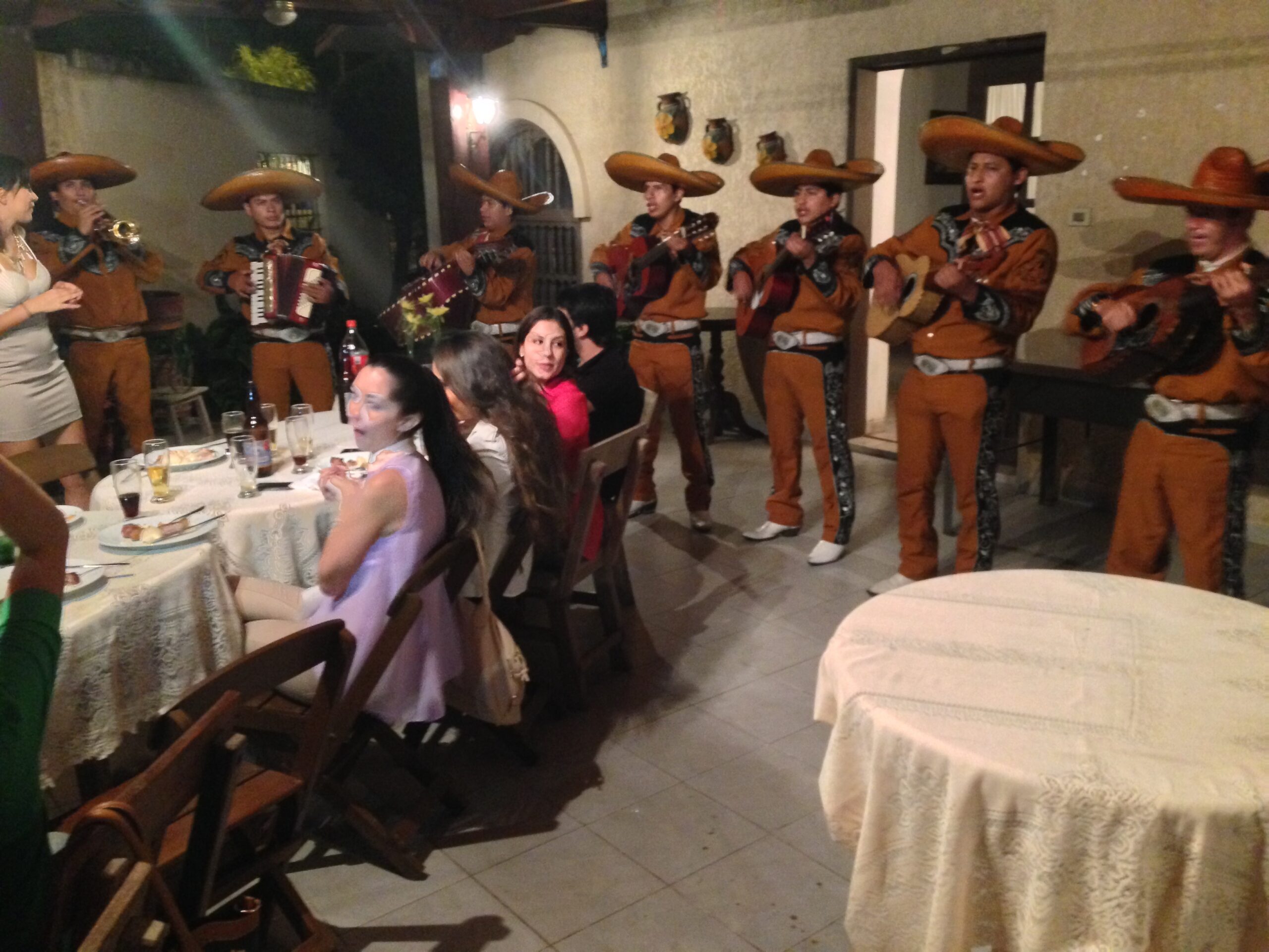 A mariachi band entertains at a Bolivian birthday party.