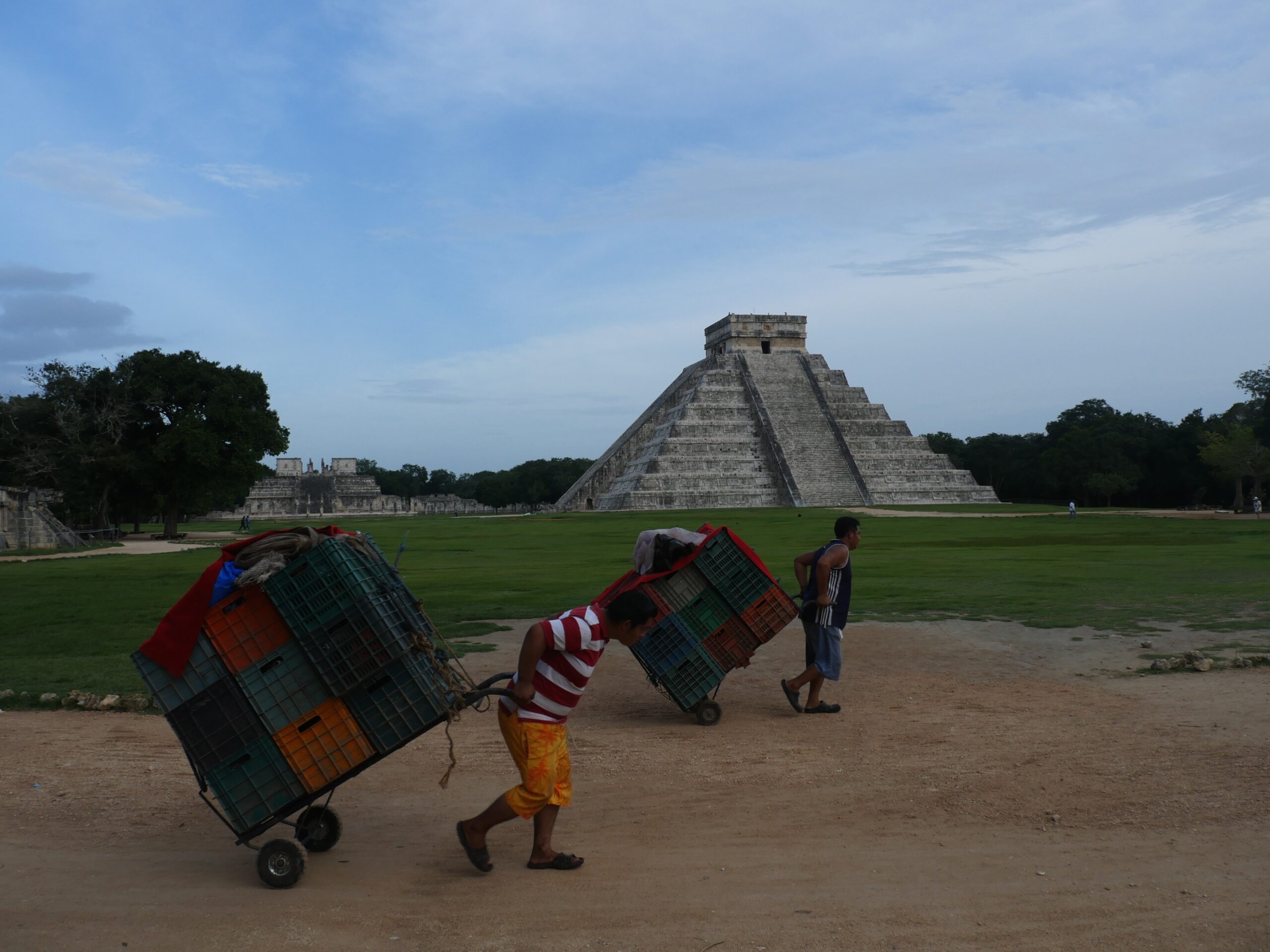 Souvenir vendors pack up their stalls at the end of the day in front of El Castillo in Chichen Itza, Mexico.