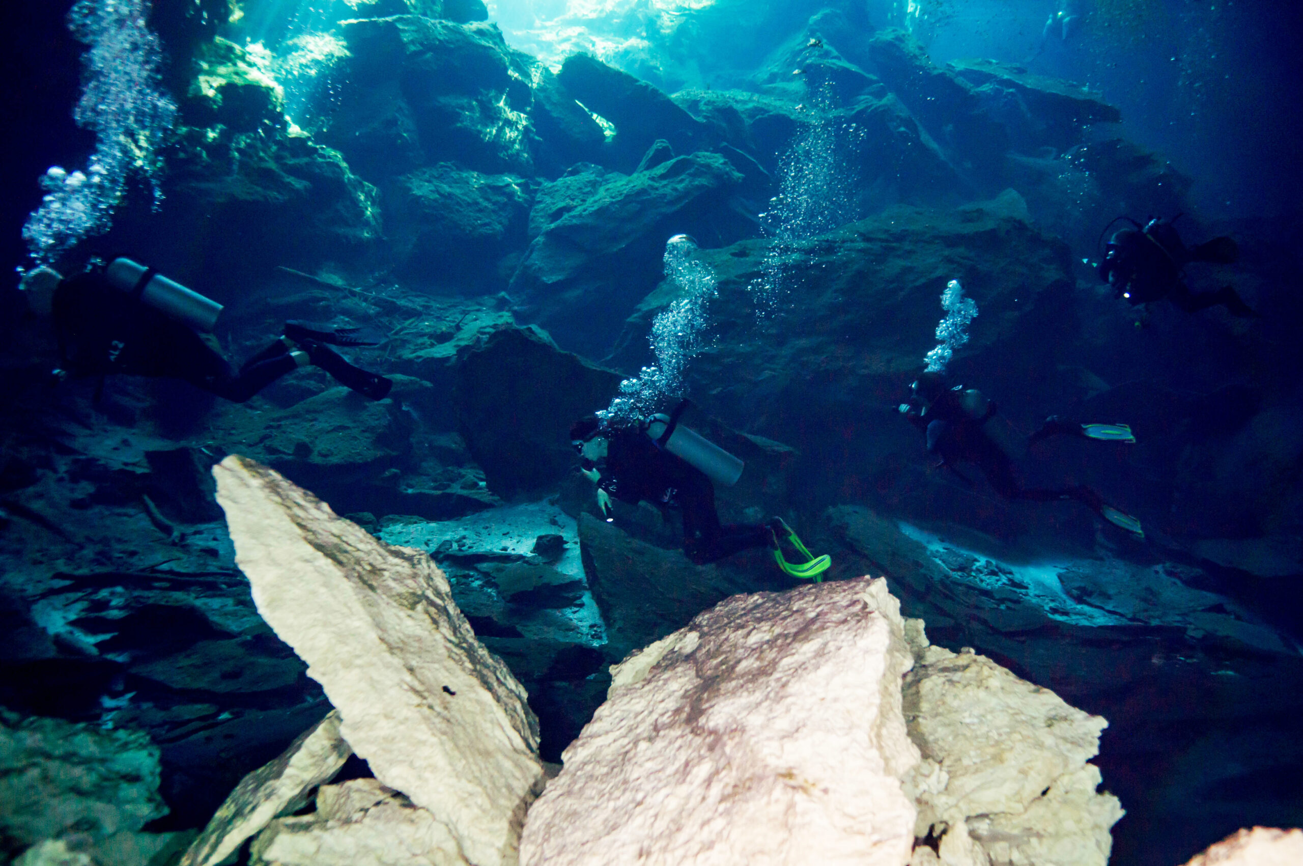 Divers swim in the Dos Ojos flooded cave system near Cancún, Mexico. (photo by Ratha Grimes)