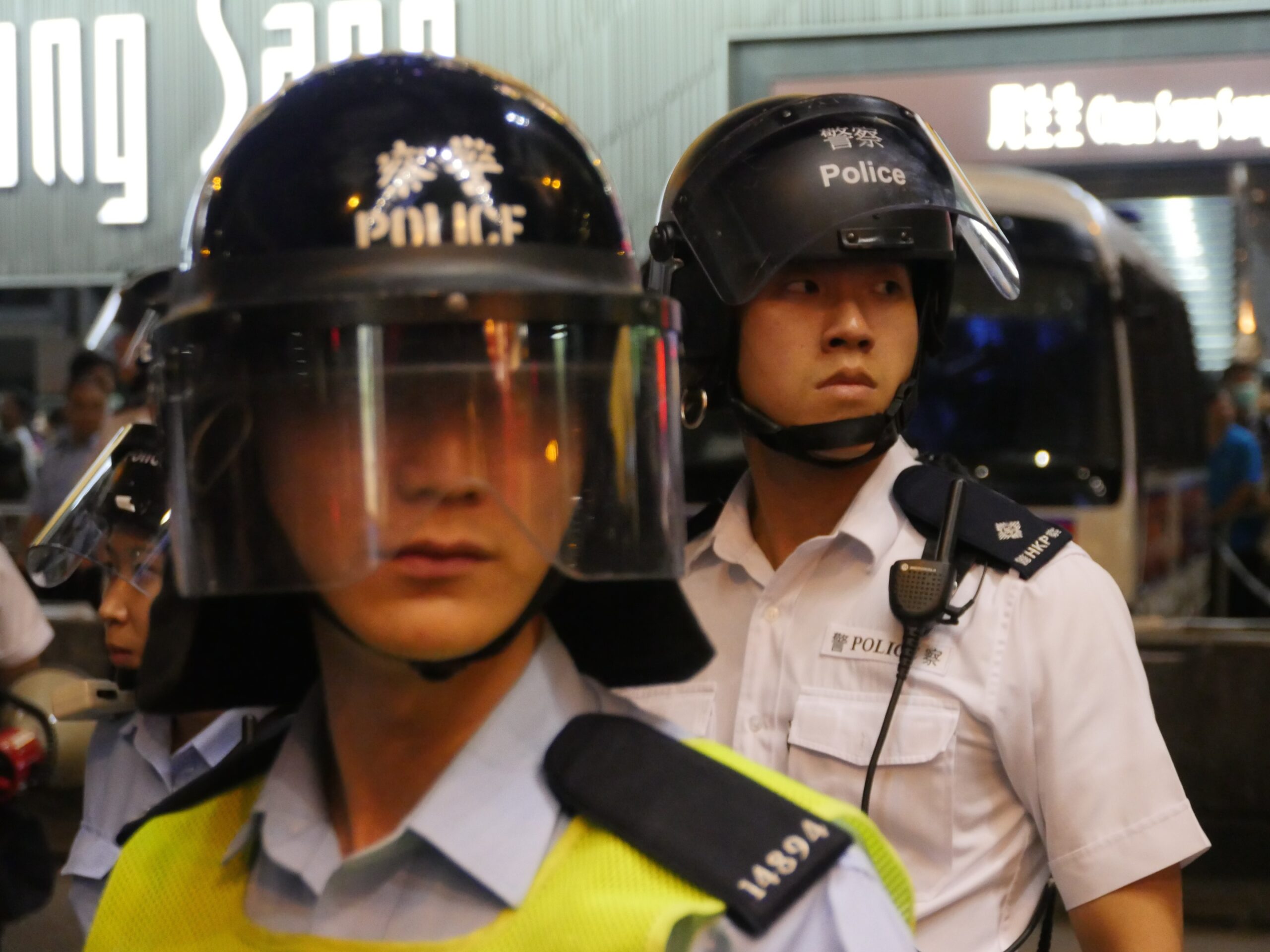 Hong Kong police don helmets and get ready to charge protesters in an attempt to clear the streets.
