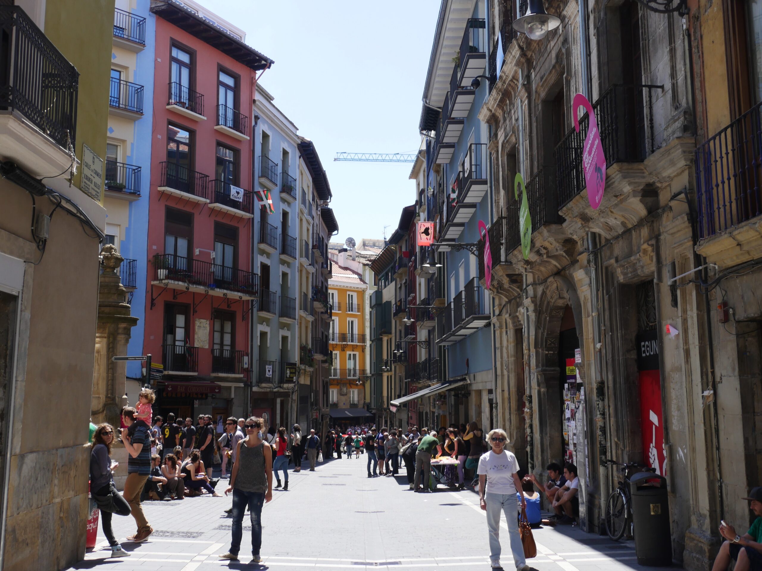 People fill the streets of Pamplona, Spain on a Saturday evening.