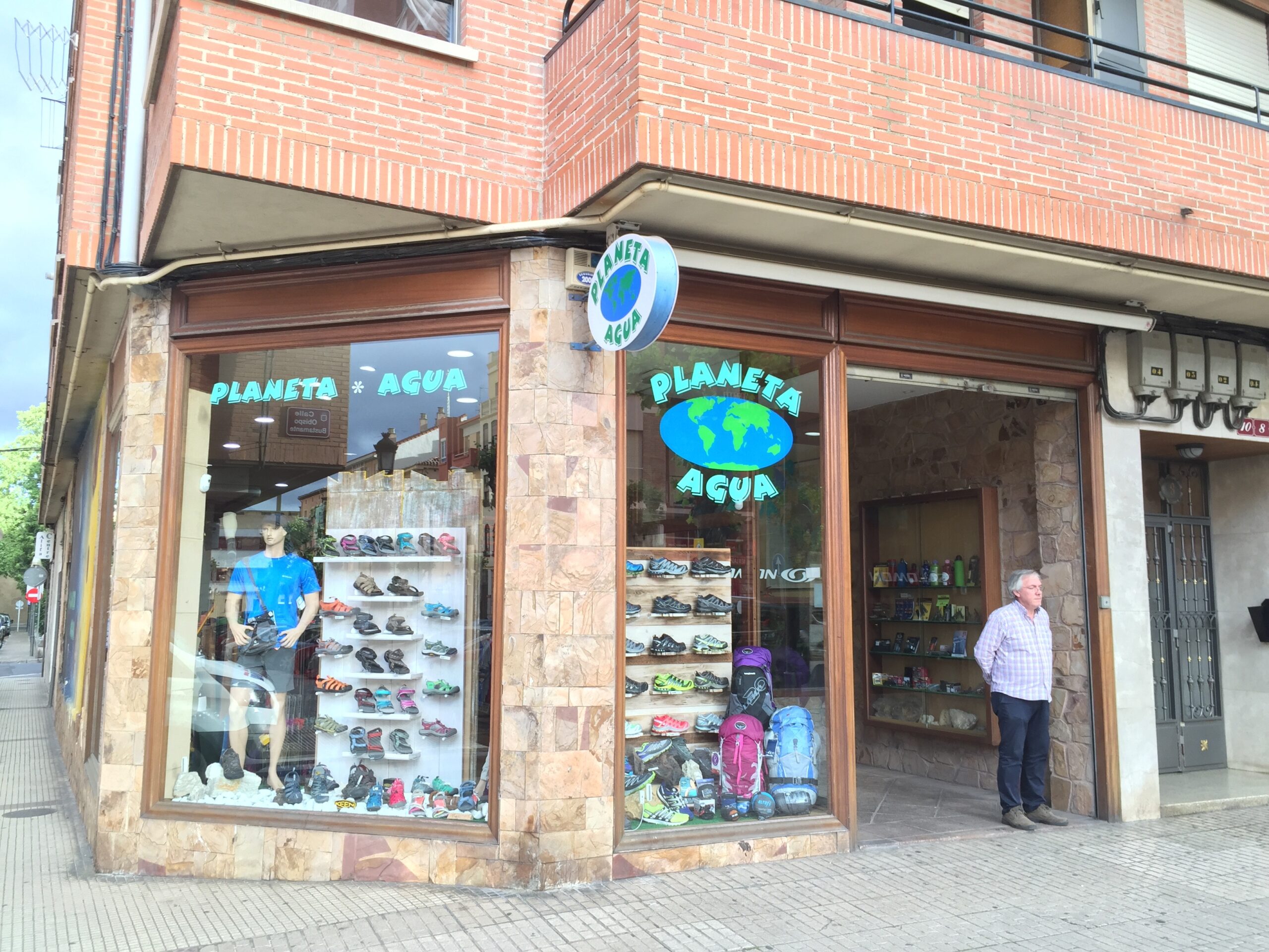 The owner of Planeta Agua stands outside the store in Logro&ntilde;o, Spain.