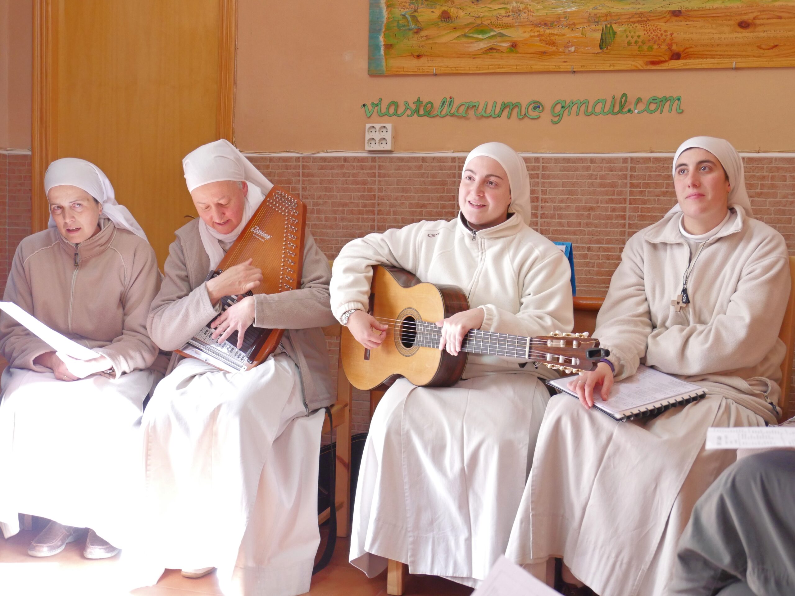 Four nuns sing in the entrance hall of the albergue in Carri&oacute;n de los Condes, Spain.
