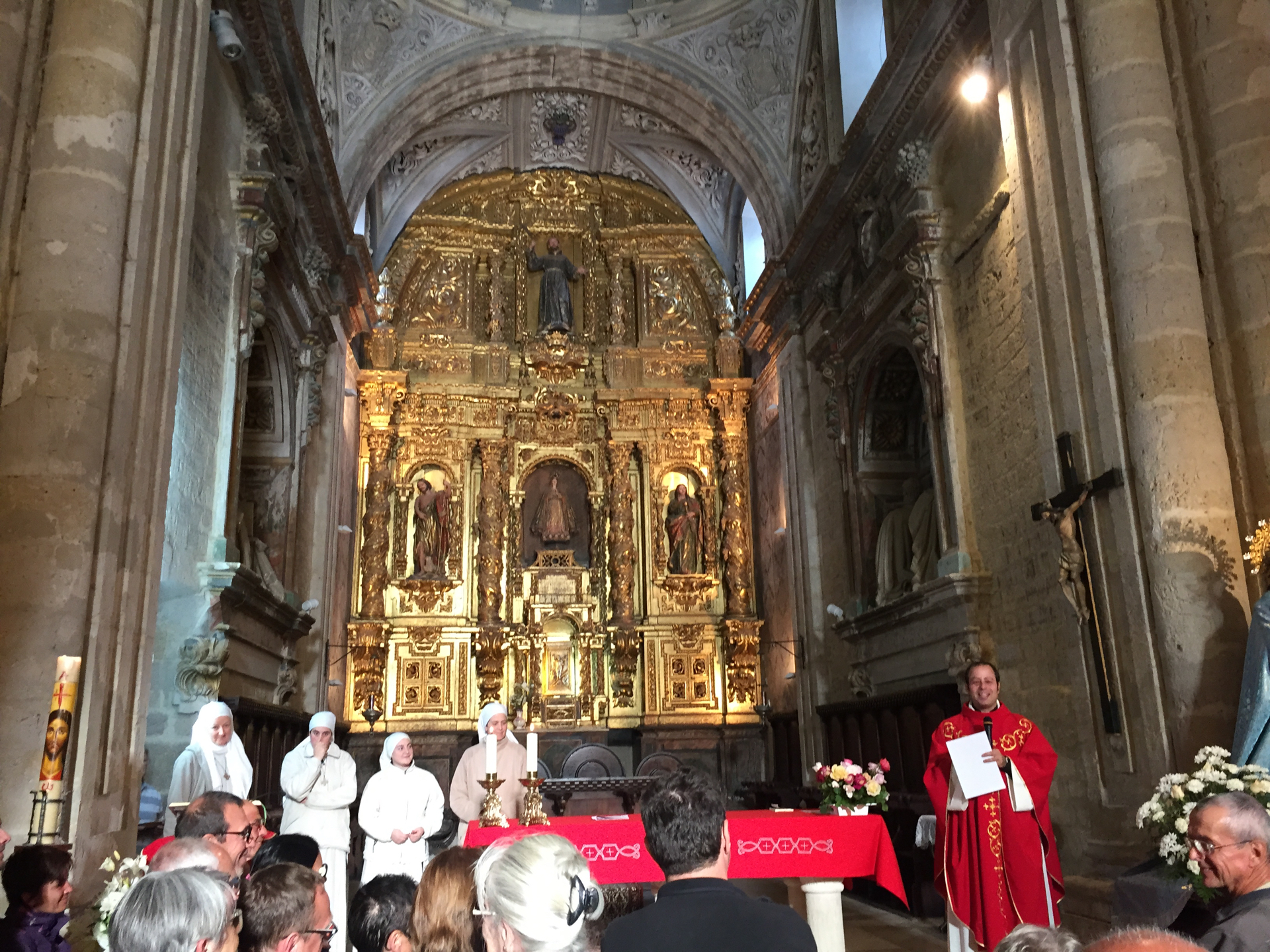 A priest performs a pilgrim blessing in the Church of Santa Mar&iacute;a in Carri&oacute;n de los Condes, Spain.