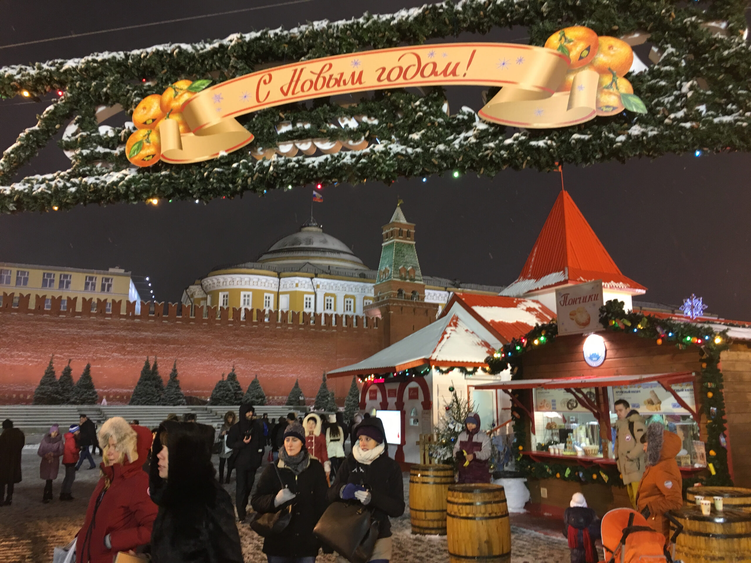 Snow falls over a Christmas market in Moscow's Red Square.