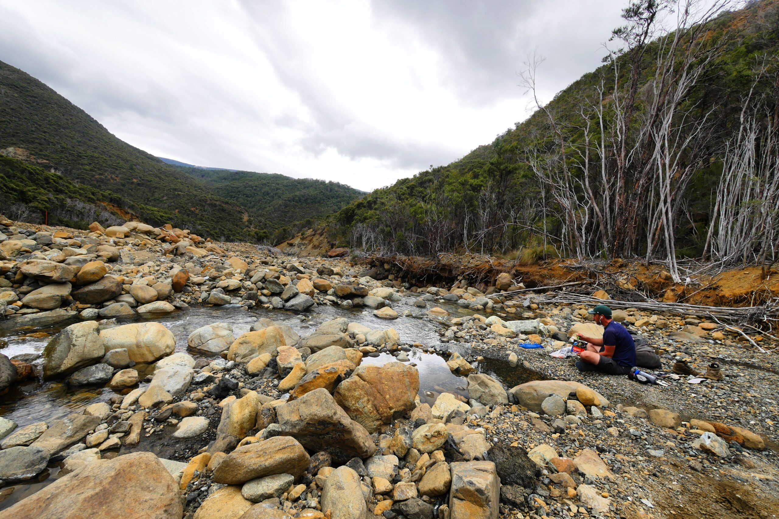 Hank enjoys his last moments in the Richmond Range by eating lunch in a river bed.