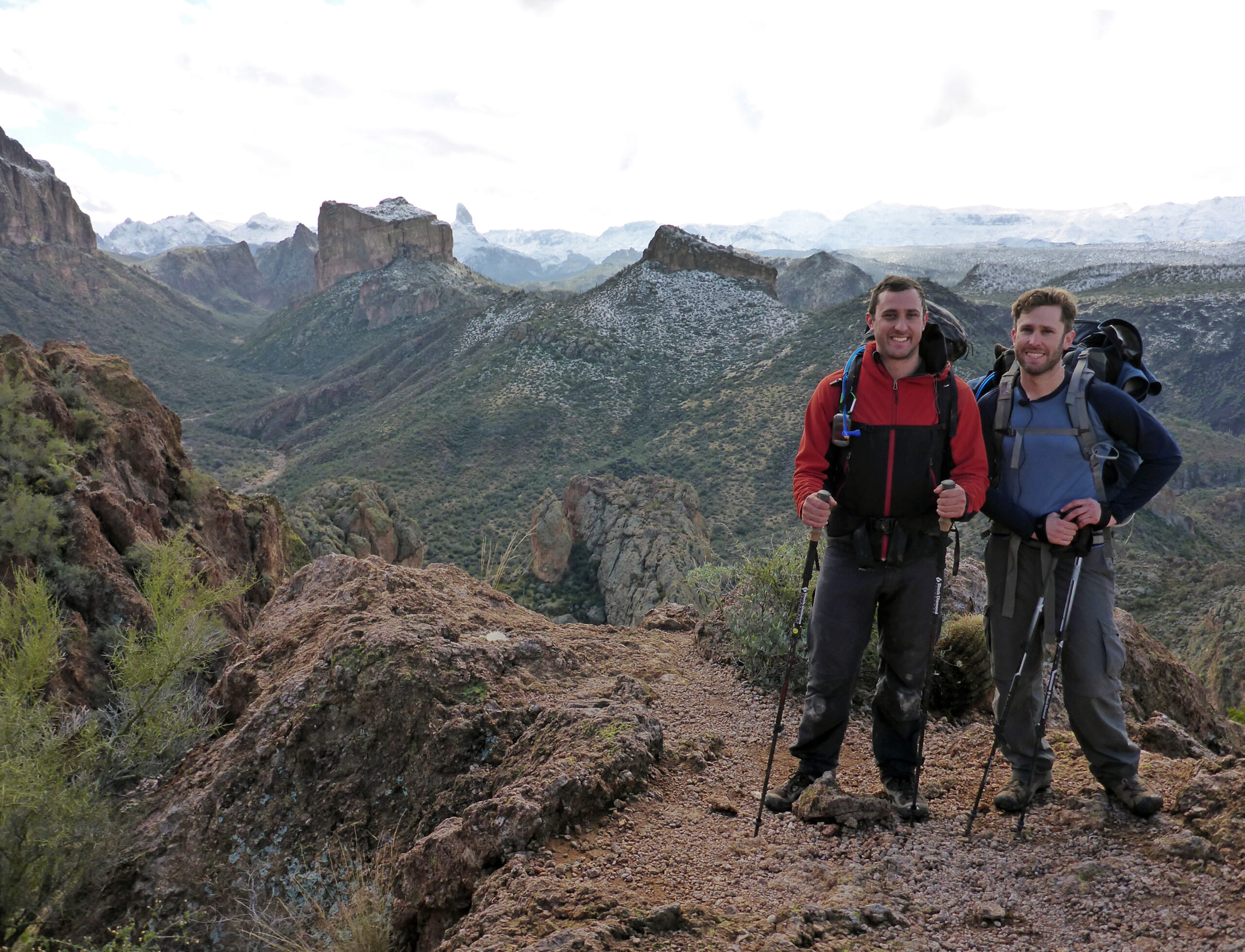 Hank and Brian stand in Arizona's Superstition Mountains on the Boulder Canyon Trail.