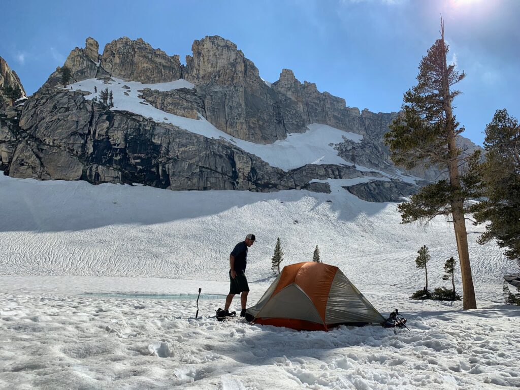 A camper near his tent at Pear Lake in Sequoia National Park